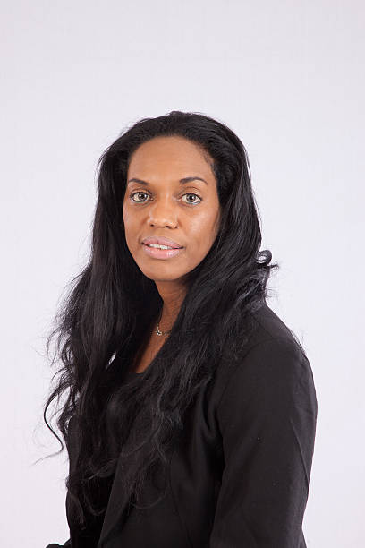 istock black woman smiling at the camera 513318303