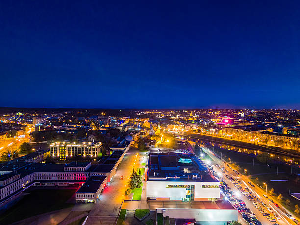 Vilnius skyline in Lithuania showing a river running through the town in the evening