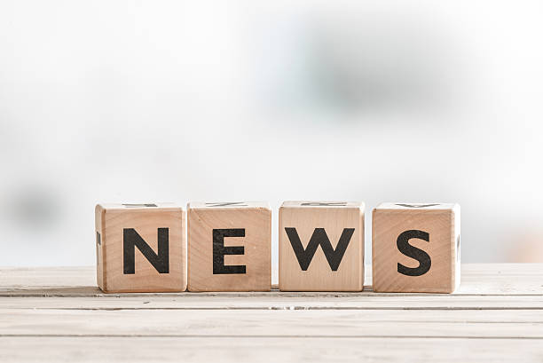 istock Wooden news sign on a table 513318814