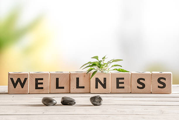 Wellness sign with wooden cubes Wellness sign with wooden cubes and flowers and stones fitness and wellness stock pictures, royalty-free photos & images