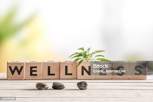 Wellness Sign With Wooden Cubes Stock Photo - Download Image Now - Wellbeing, Single Word, Sign