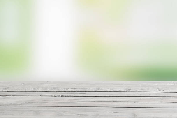 istock Wooden table in green nature 513319340
