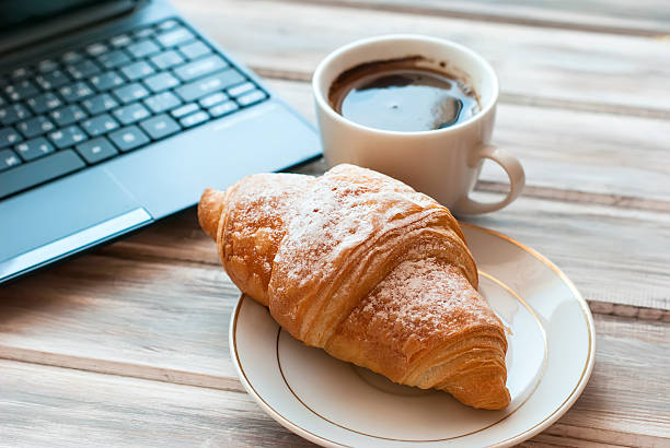 istock Breakfast with coffee and croissant 513319426
