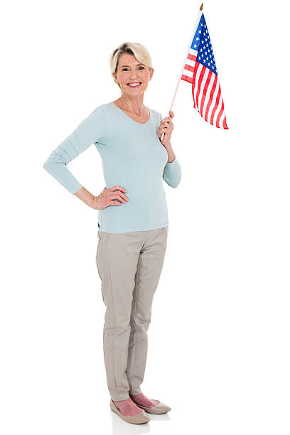 istock senior woman with american flag 513319672