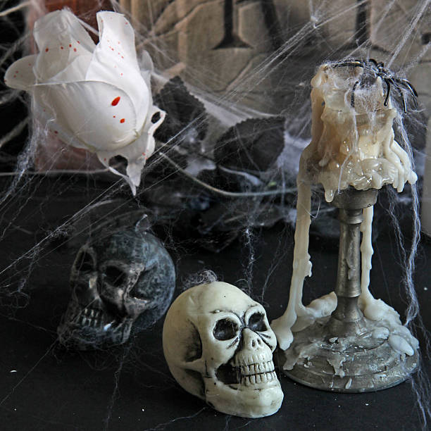 istock Halloween background with  tombstone, scull, candles, 513319721