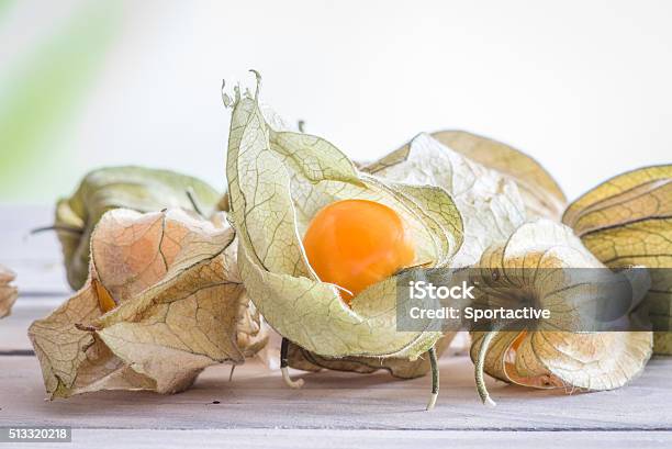 Physalis Peruviana Fruit On A Table Stock Photo - Download Image Now - Autumn, Backgrounds, Desk