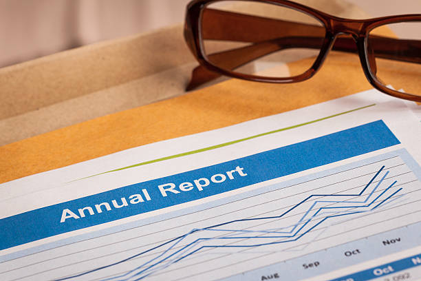 istock Annual Report letter document and eyeglass 513320266