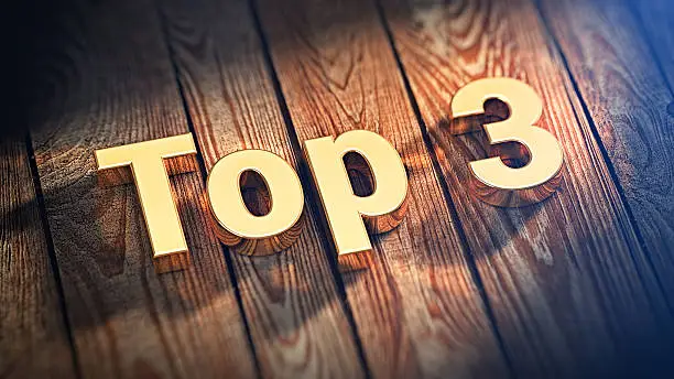 Photo of Word Top 3 on wood planks