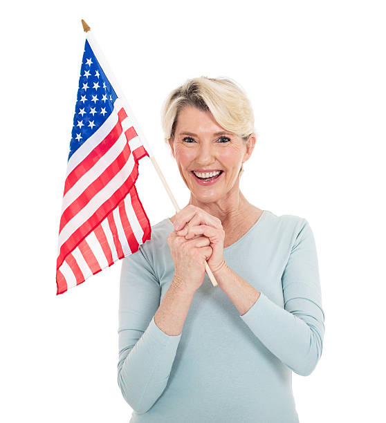 istock mature woman with american flag 513320508