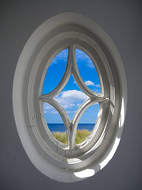 istock ancient window with a view to the sea 513320681