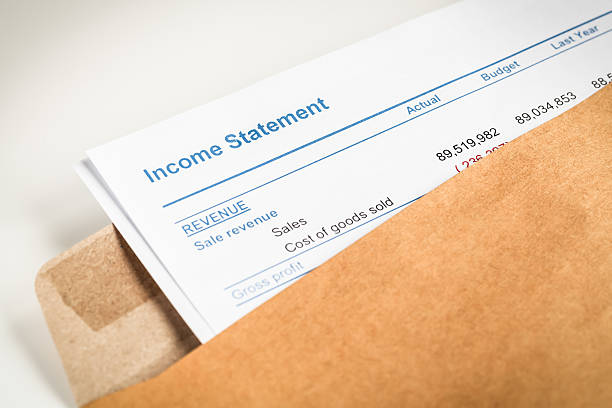 istock Income statement letter in brown envelope opening 513321204