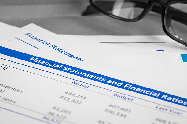 istock Financial statement letter on brown envelope and eyeglass 513322236