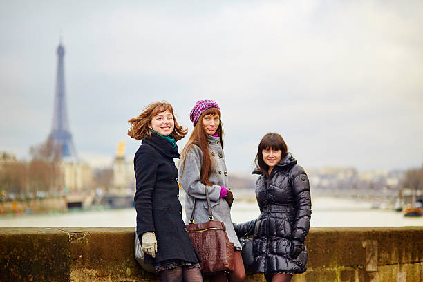 istock Three cheerful girls walking together in Paris 513322318