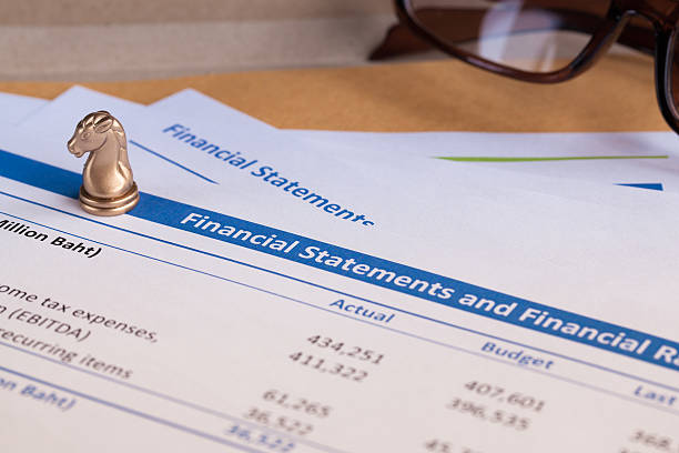 istock Financial statement letter on brown envelope and eyeglass 513322422