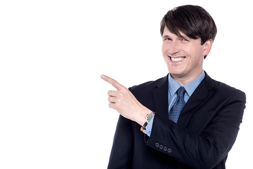 Male executive pointing his index finger at something