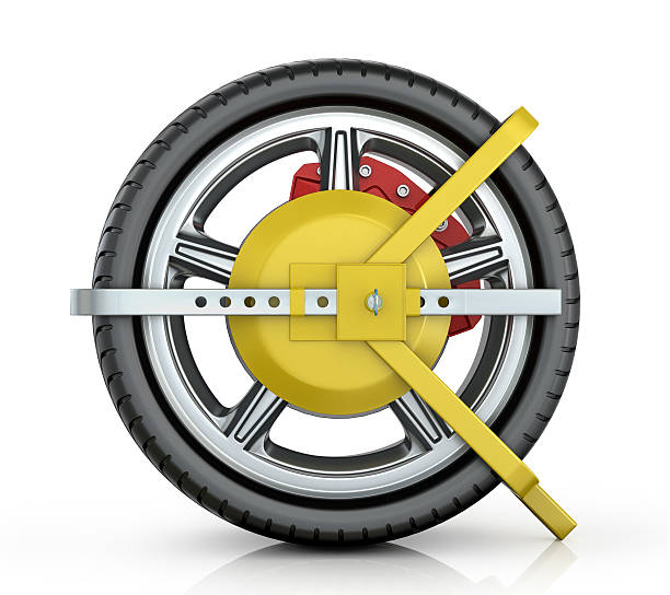 Yellow wheel clamp Yellow wheel clamp on a white background. car boot stock pictures, royalty-free photos & images