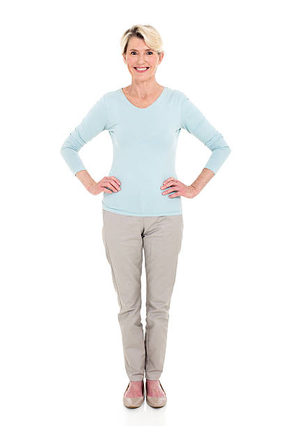 istock senior woman standing on white 513324556