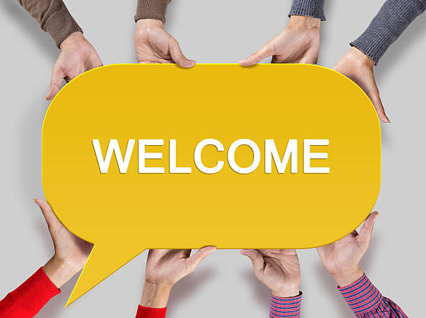 Group of friends showing welcome sign on speech bubble