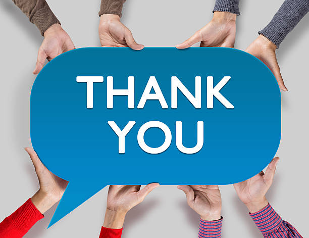 Group of friends showing thanks text written on speech bubble