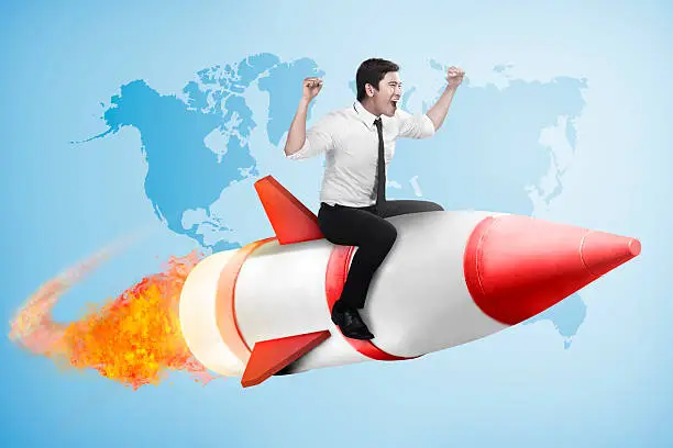 Photo of asian business man flying ride rocket