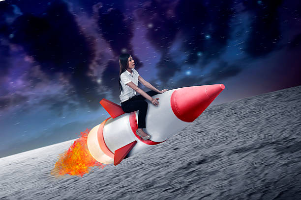 istock asian business woman flying ride rocket 513325334
