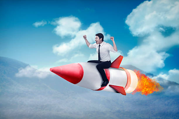 istock asian business man flying ride rocket 513325420