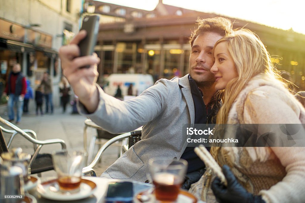 Lovely Spanish couple making selfie in Madrid Cafe Adult Stock Photo