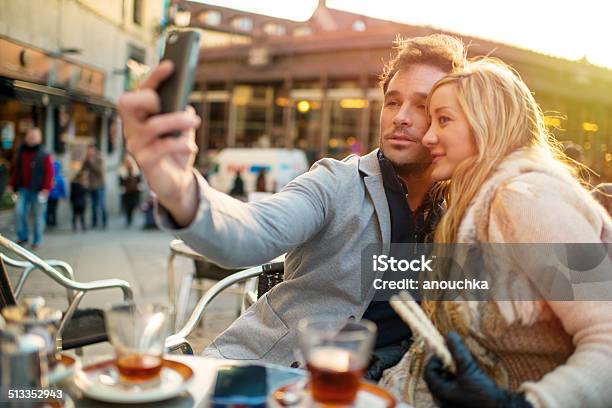 Lovely Spanish Couple Making Selfie In Madrid Cafe Stock Photo - Download Image Now - Adult, Adults Only, Back Lit