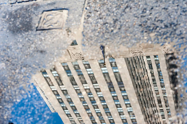 istock rockerfeller center reflecting in water 513354365