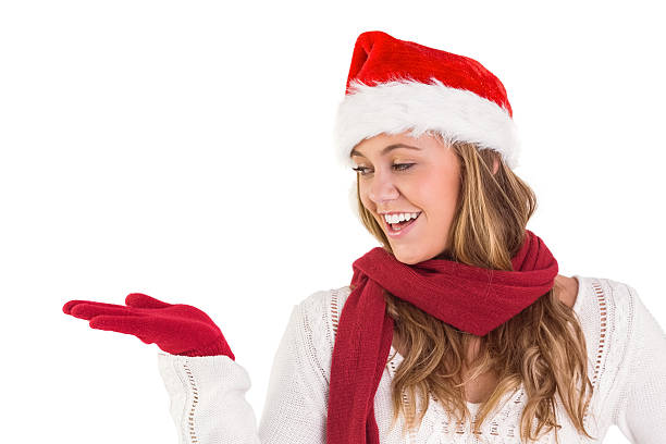 istock Festive blonde presenting with hand 513354427