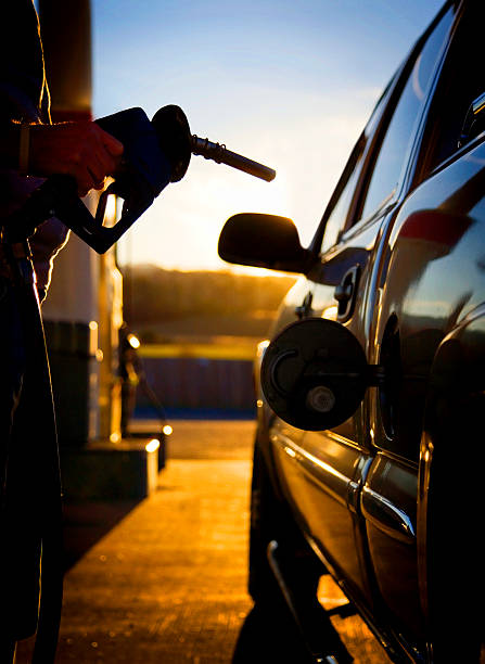 istock Gas pump filling up a car. 513355489