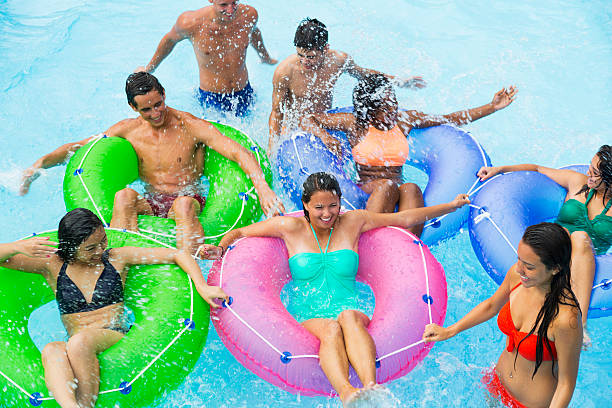 istock Teenage friends floating on innertubes 513358467