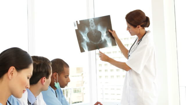 Medical team discussing an xray during meeting