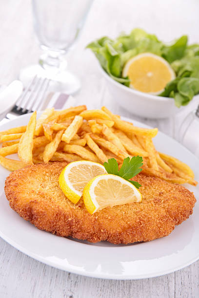istock breaded meat and fries 513359873