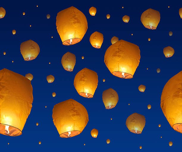 istock background with yellow paper lanterns in night sky 513362832