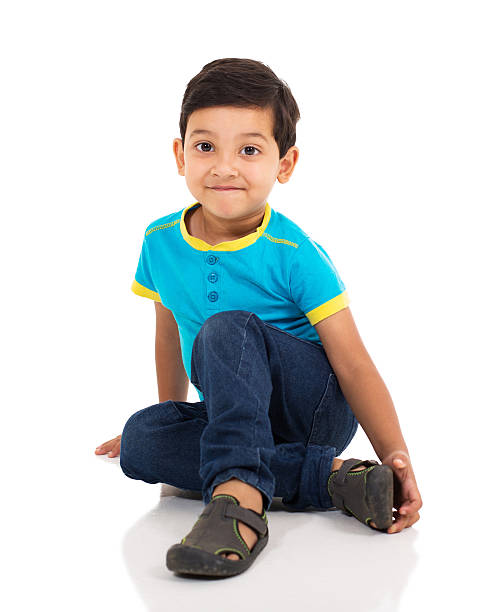 istock little indian boy sitting on the floor 513363774