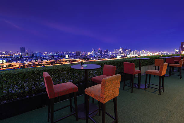 istock Restaurant dining table and view of business building on terrace 513364554