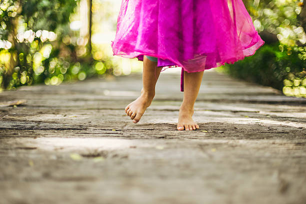 istock Girl walking in garden path 513364692