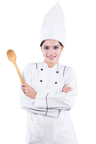 istock Female chef with spoon in the studio 513364876