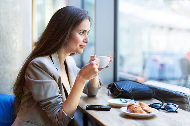 istock Young woman at cafe 513364974