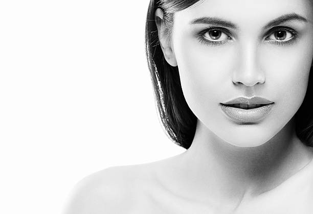 istock Beautiful woman face close up studio white sexy lips 513366922