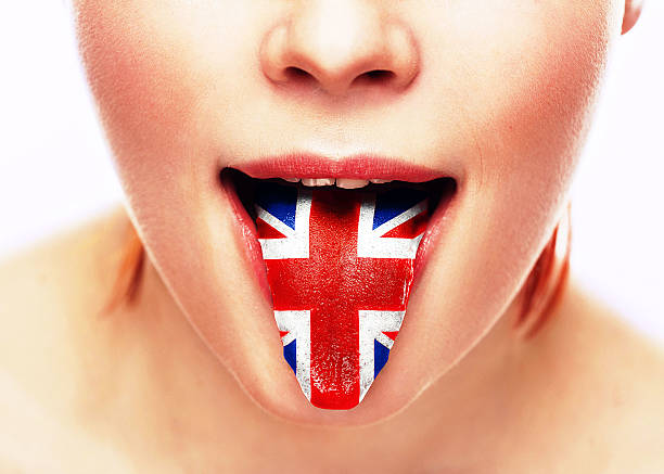 english language tongue open mouth with flag britain woman face - mensentong stockfoto's en -beelden
