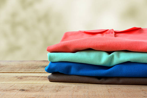 istock Stack of polo shirt on wooden. 513368206