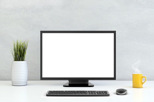 White brick wall, with PC working setup in front of it, white