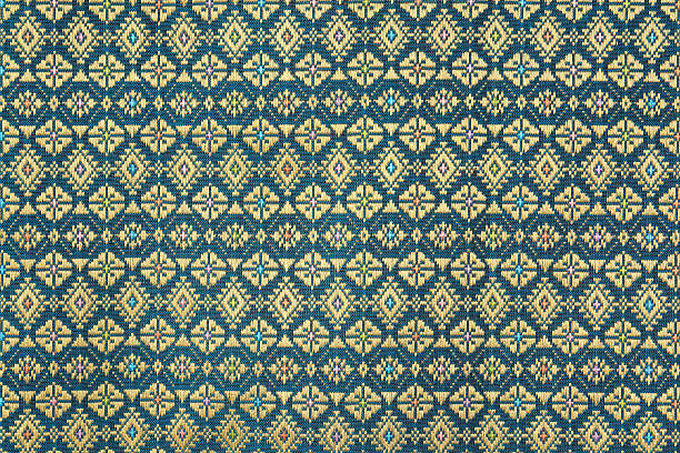 istock Colorful thai silk handcraft peruvian style rug surface close up 513368760
