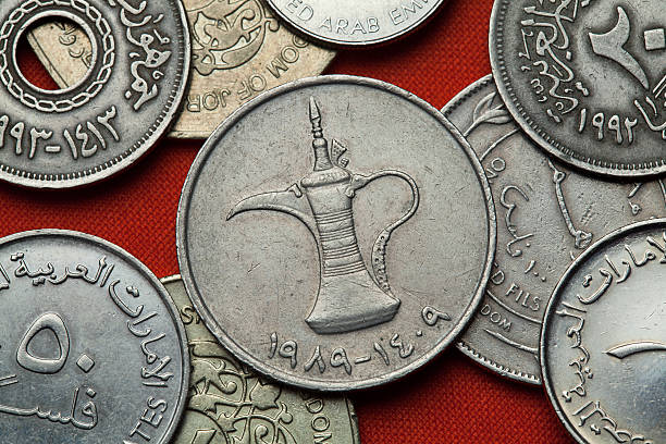 Coins of the United Arab Emirates Coins of the United Arab Emirates. Arab tea pot depicted in the UAE one dirham coin. moroccan currency photos stock pictures, royalty-free photos & images