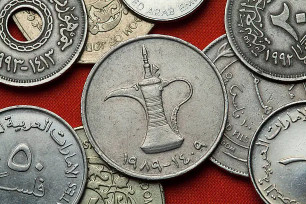 Coins of the United Arab Emirates. Arab tea pot depicted in the UAE one dirham coin.