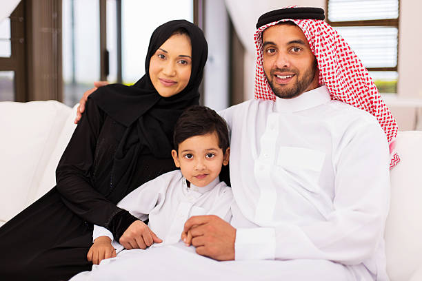 istock young arabian family sitting on sofa at home 513373122