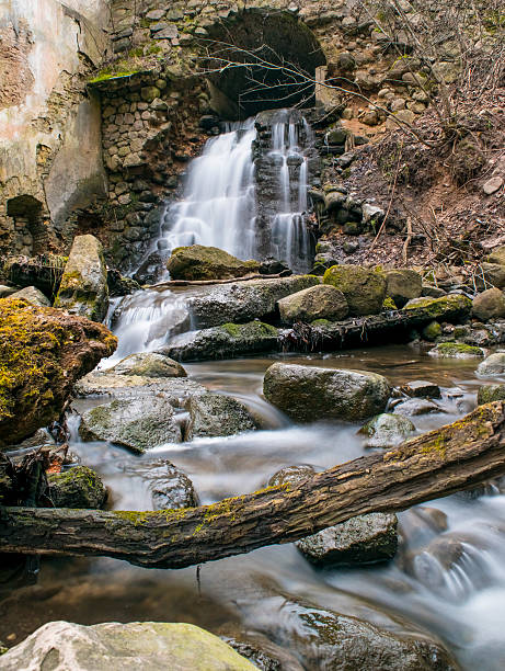 istock waterfall from the arch at abandoned place 513374020