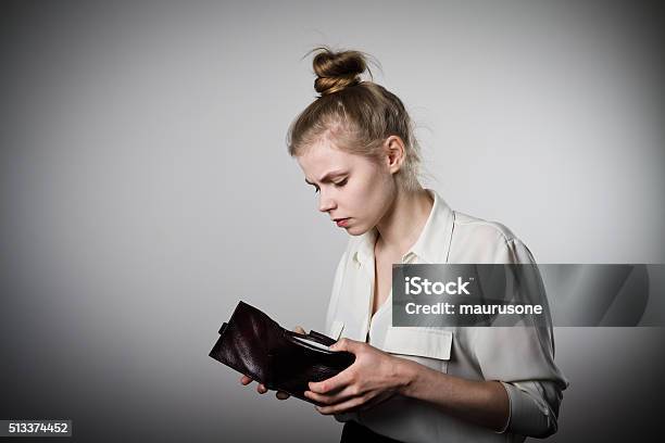 Woman And Empty Wallet Stock Photo - Download Image Now - Anxiety, Wallet, Charity and Relief Work